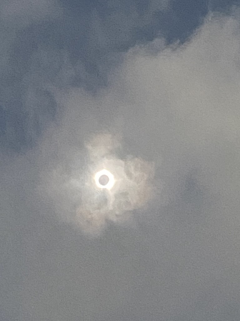 A photo of the eclipse through clouds